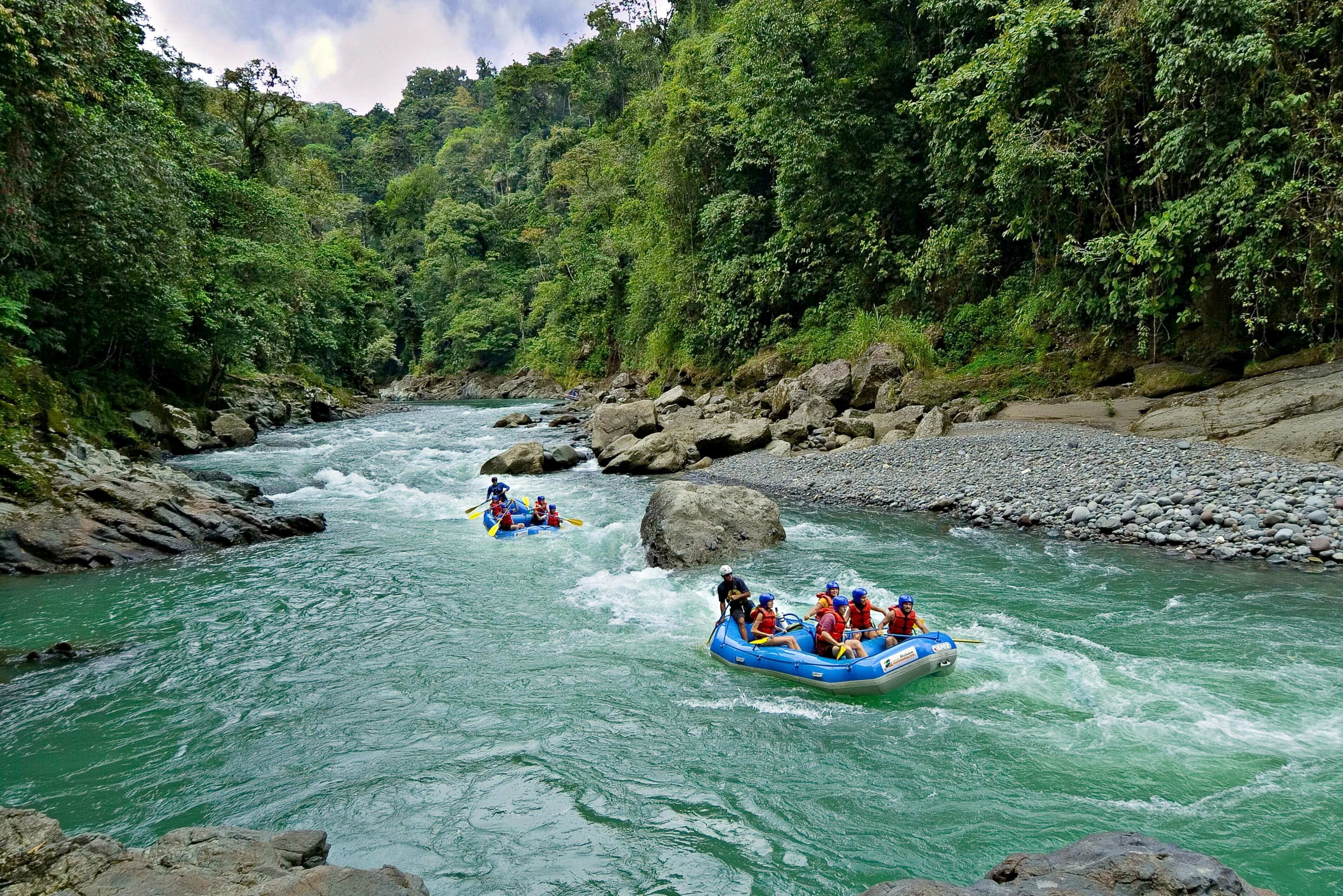 White-water rafting on the Pacuare River through lush rainforest in Costa Rica. 