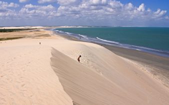 Vast sand dunes at Duna do Por do Sol in Jericoacoara, Ceara, Brazil, with ocean views and ridge.  