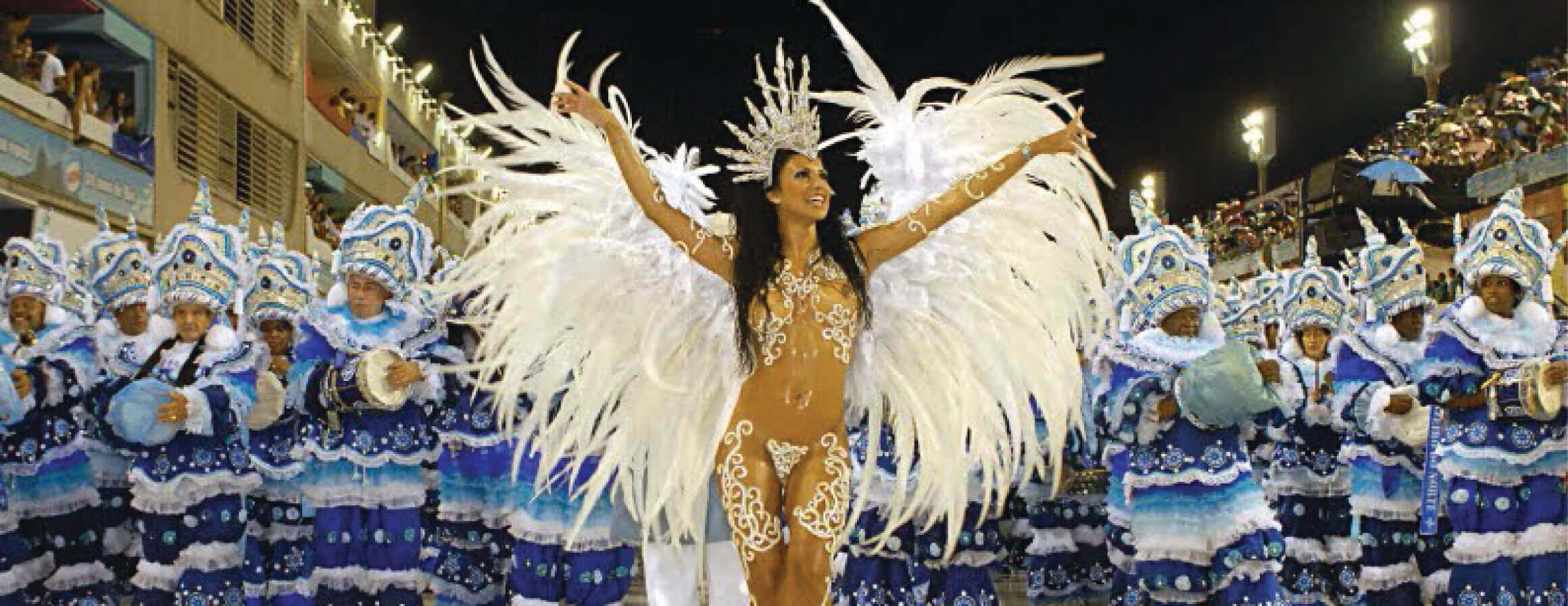Samba queen in feathered costume leading Rocinha school at Rio Carnival parade, Brazil. 