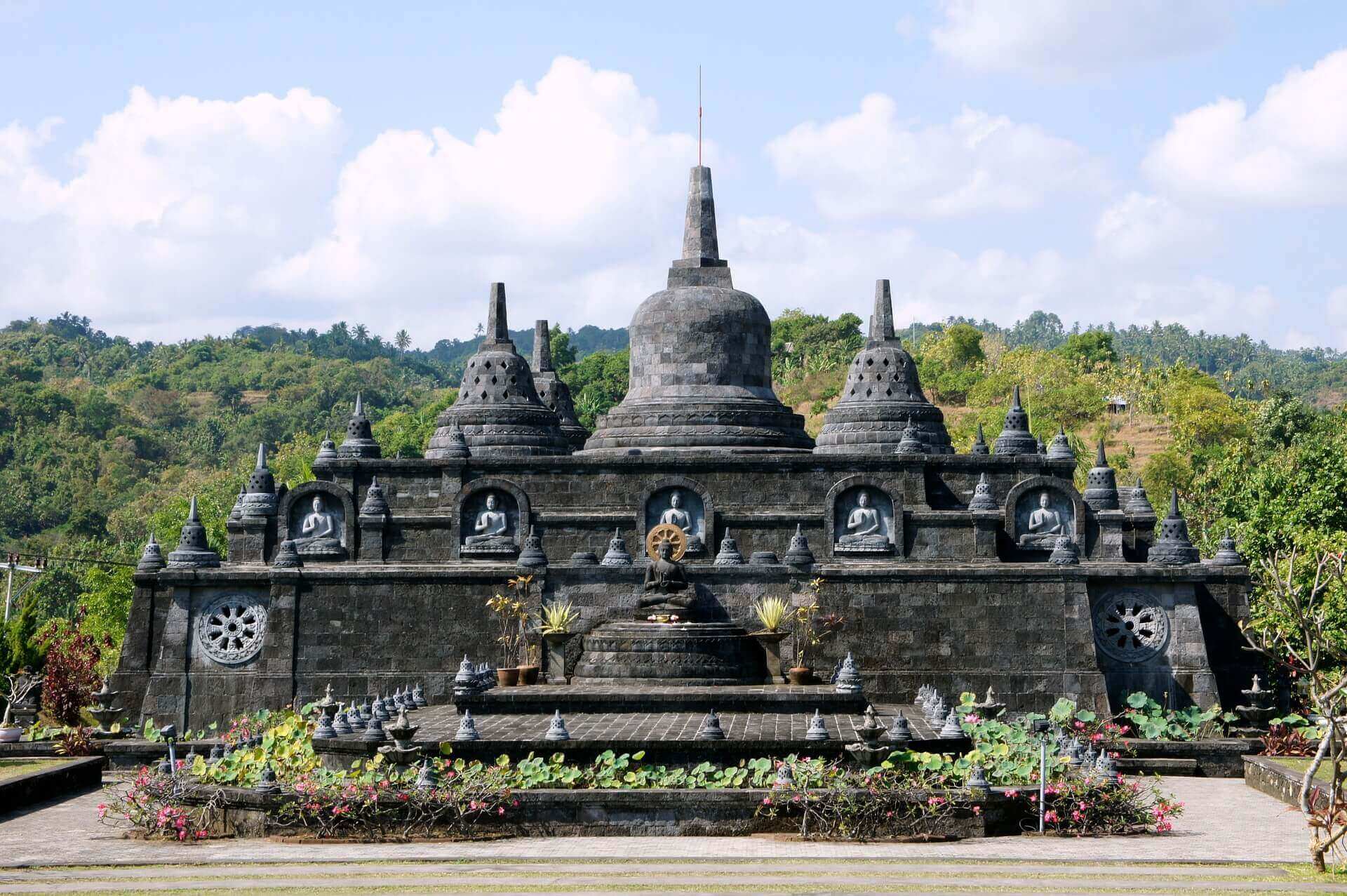 Brahma Vihara Arama, a peaceful Buddhist temple in North Bali, featuring intricate stone stupas and tropical gardens. 