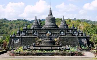 Brahma Vihara Arama, a peaceful Buddhist temple in North Bali, featuring intricate stone stupas and tropical gardens. 