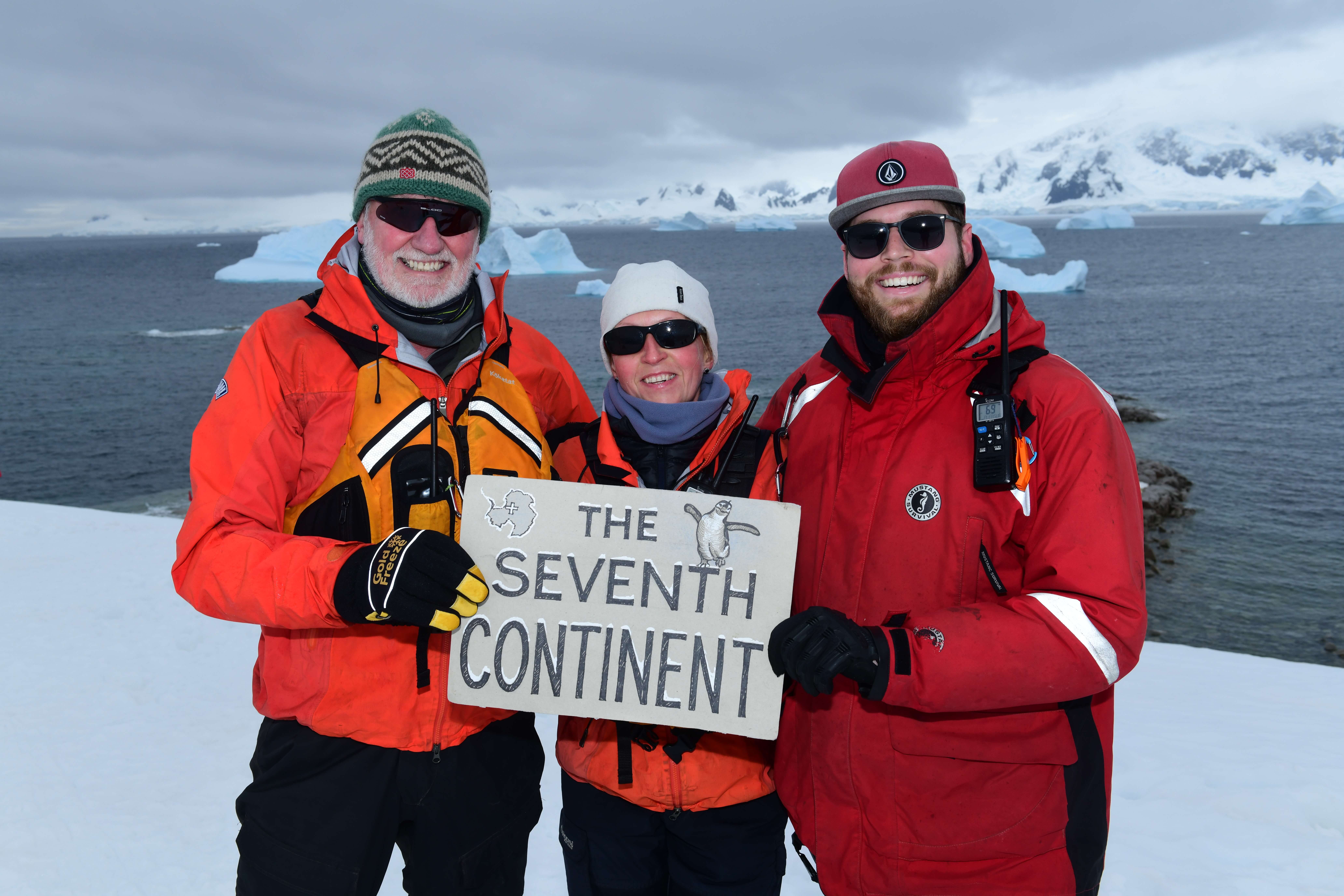 Expedition guests celebrate reaching Antarctica, the world's seventh continent. 