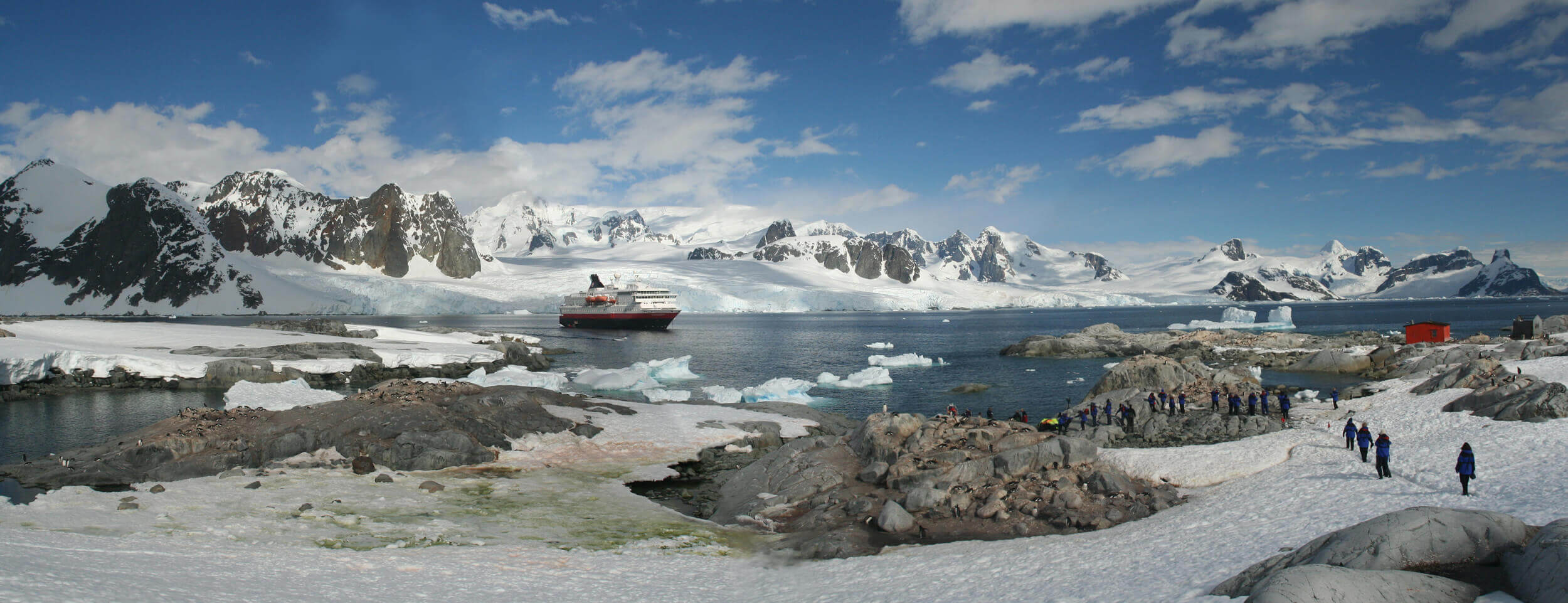 Expedition cruise lands in Antarctica amid glaciers, mountains, and wildlife. 